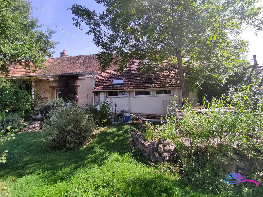 facade arrière - Maison à EPINEUIL-LE-FLEURIEL